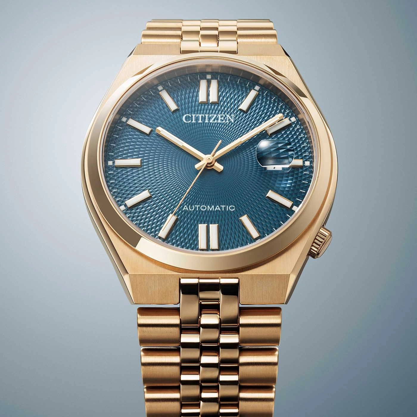 Gouden Citizen automatische horloge met blauwe, getextureerde wijzerplaat.
