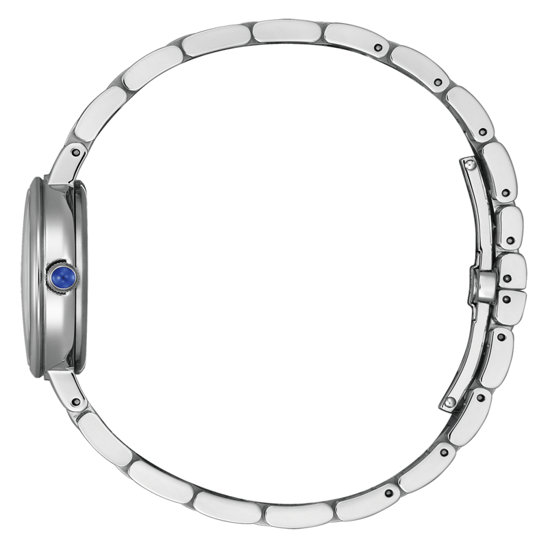 Montre argentée avec gemme bleue, vue latérale, sur fond vert