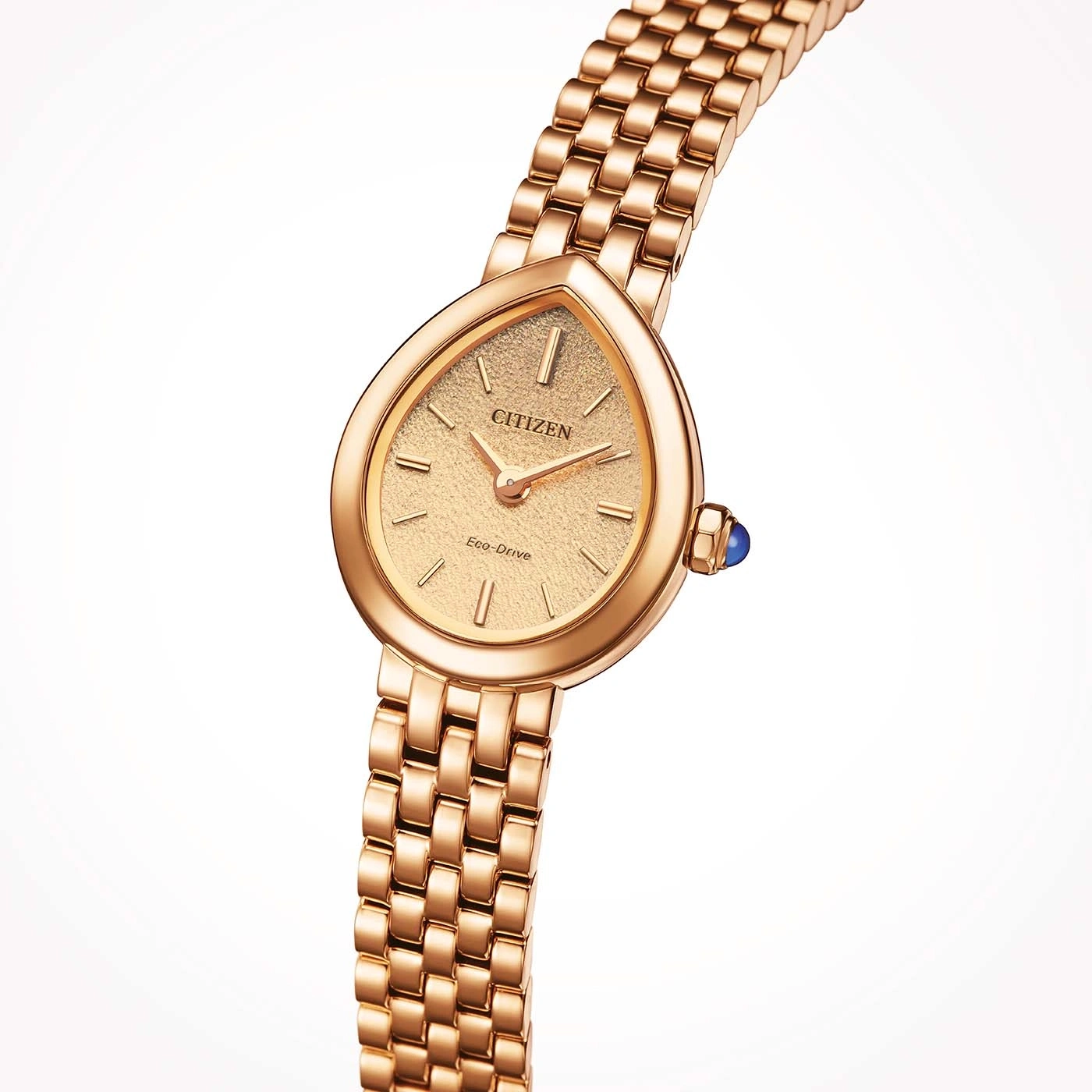 Une montre élégante en or rose avec un cadran texturé et un bracelet assorti.