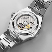 Dos de montre Citizen, mécanisme apparent, acier inoxydable, verre saphir, étanche.