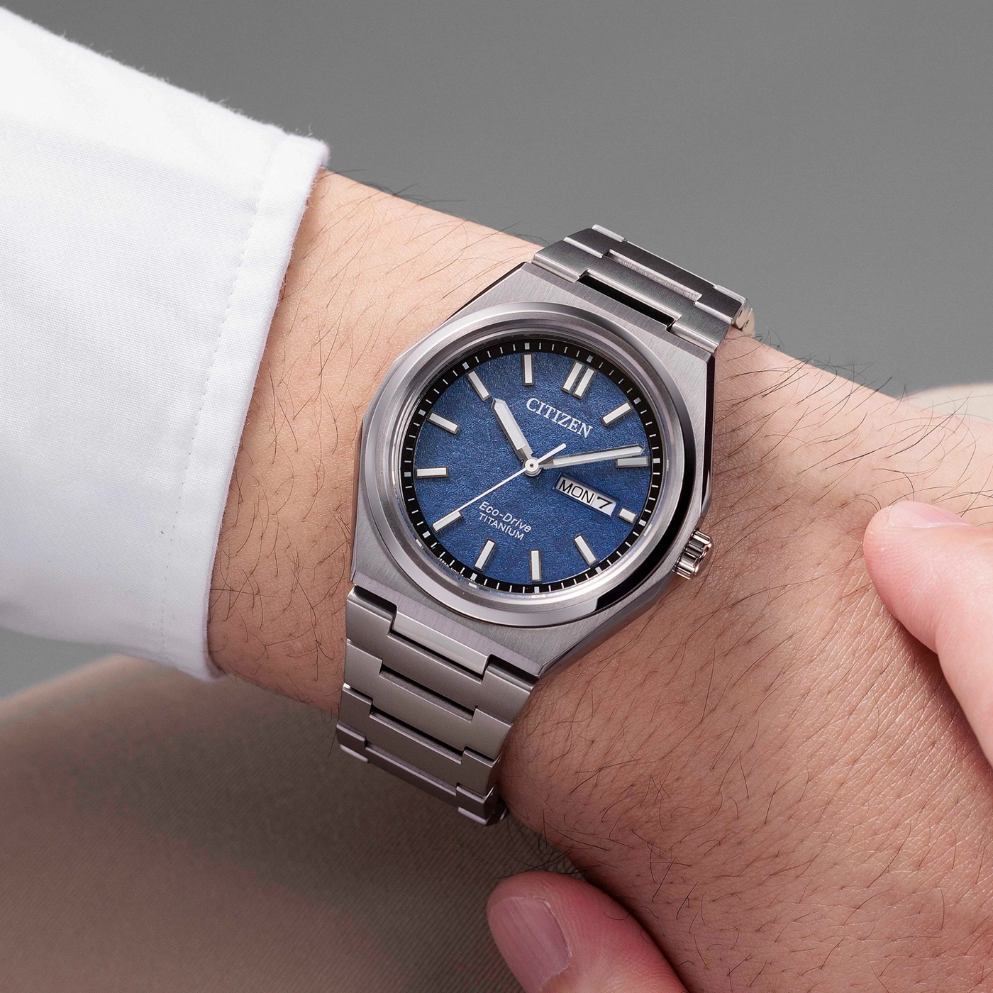 Citizen Eco-Drive Titanium watch with blue dial worn on wrist