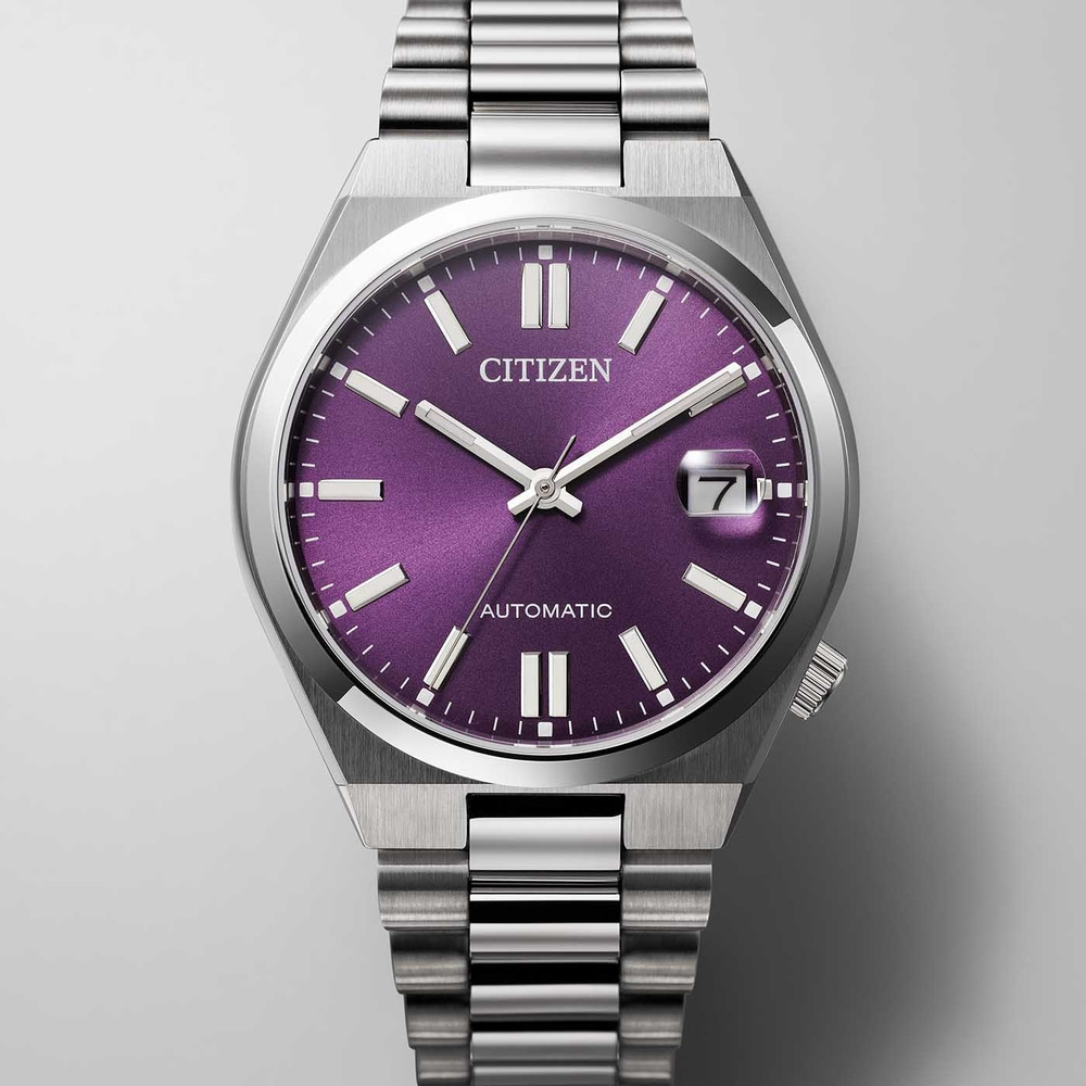 Montre Citizen avec cadran violet et bracelet argenté, automatique.