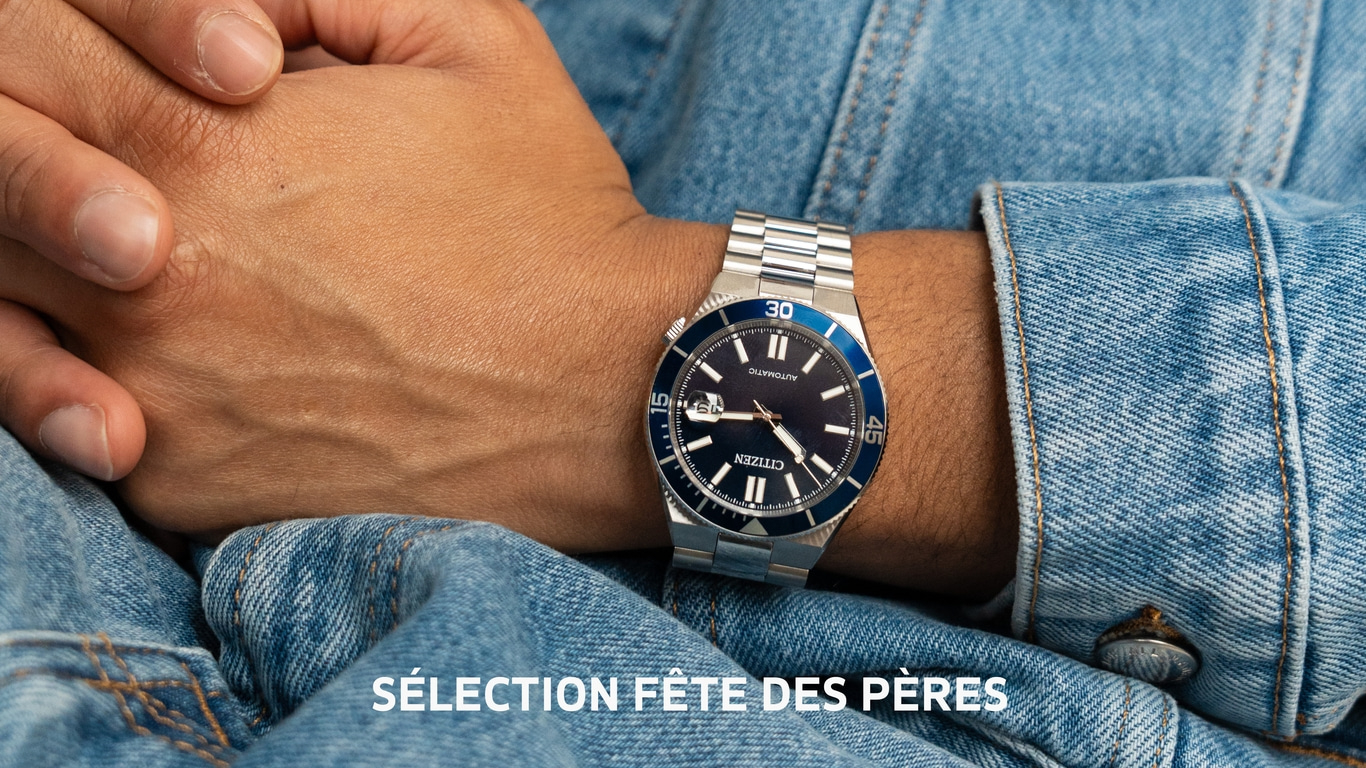 Une montre Citizen avec le texte SÉLECTION FÊTE DES PÈRES sur un jean.